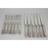 A set of six George III silver dessert knives and forks, maker Moses Brent, London 1806, 16oz gross