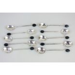 A matched set of ten George V silver bean handled coffee spoons, makers Mappin & Webb, Sheffield