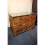 A George III mahogany and satinwood cross-banded chest of six short drawers with brass drop handles,