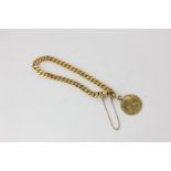 A 14ct gold curb link bracelet hung with a gold coin, 23.2g