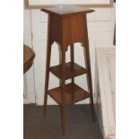 An Edwardian inlaid mahogany jardiniere stand with two uniting shelves, on tapered legs, 29cm wide