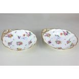 A pair of 19th century Nantgarw porcelain shell shaped dishes with gilt shell handles, decorated