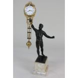 A late 19th / early 20th century pendulum timepiece in the form of a bronzed figure of an athlete