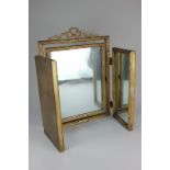 A giltwood and gesso framed three-panel dressing table mirror with pierced ribbon surmount,