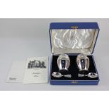 A cased pair of George VI silver tea caddies with matching caddy spoons, makers Reid & Sons Ltd,
