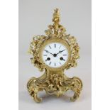 A 19th century French gilt metal cased mantel clock, the case with pineapple shaped finial and