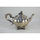 A Victorian silver teapot, makers Mappin Brothers, London 1871, of melon form with gourd finial,