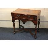 A William and Mary style walnut side table with quarter veneered and cross-banded rectangular top