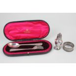 An Edward VII silver matched christening set of spoon and fork, in case, with engraved design,