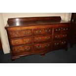 A George III oak mule chest with raised gallery back and crossbanded rectangular lifting top above