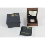 A Royal Mint boxed gold proof sovereign dated 2013, with certificate and paperwork