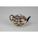 A Royal Crown Derby miniature porcelain teapot, Imari pattern 6299, 6cm