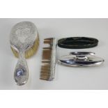 A George V silver mounted nail buffer opening to reveal a manicure set, makers Mappin & Webb,