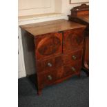 A 19th century flame mahogany cabinet commode, two inlaid panel doors over two long drawers, on