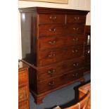 A George III mahogany chest on chest, the top section with two short over two long drawers, the base