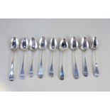 A matched set of nine George III and later silver Old English pattern teaspoons, monogrammed, 3oz