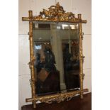 A 19th century giltwood rectangular wall mirror, the surmount pierced with flowers and foliage,