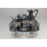A five-piece silver plated tea set of tray, teapot, hot water pot, sugar bowl and milk jug, and a