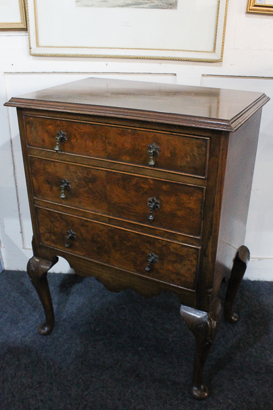 A walnut small chest of three drawers, on cabriole legs, 50cm