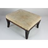A Regency mahogany footstool with reeded sabre legs and cream upholstered top, 28cm