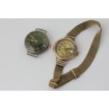 A lady's 9ct gold watch on gilt metal bracelet, and a silver watch