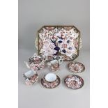 A Royal Crown Derby porcelain matched part tea set with Imari decoration and gilt embellishments,