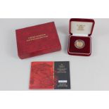A Royal Mint United Kingdom gold proof half-sovereign dated 2001, with certificate and