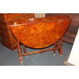 A Victorian burr walnut Sutherland table on turned supports with uniting stretcher, on trestle