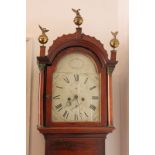 A George III mahogany longcase clock, the 12 inch domed painted dial with secondary and date dial,