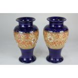 A pair of Royal Doulton Slaters Stoneware baluster vases decorated with textured floral and gilt