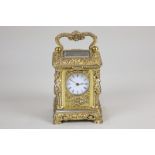 An ornate brass miniature carriage clock by Richard & Cie, probably by Adolf Ollier, the case cast