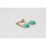 A pair of gold mounted turquoise drop earrings