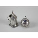 A German silver miniature tankard with embossed design of lovers and a putto finial, with import
