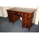 A James Shoolbred & Co mahogany and satinwood inlaid writing desk with green leather inset