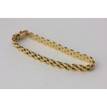 An 18ct yellow gold three-row bracelet, 15.7g