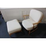 A light Ercol armchair with matching stool