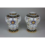 A pair of French Gien faience baluster vases with classical polychrome decoration on white ground,