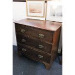 A 19th century mahogany chest of three drawers with brass drop handles and flower embossed back