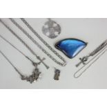 Six various silver necklaces, a butterfly wing brooch, and a silver owl pendant