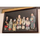 An early 20th century Japanese painted silk and collage picture of the seven lucky gods, in glazed