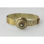 A Victorian gold bracelet, the mesh band with central hinged compartment, glazed and rose diamond