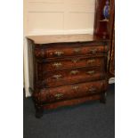 A 19th century Dutch marquetry inlaid bombe chest of four graduated drawers with brass drop