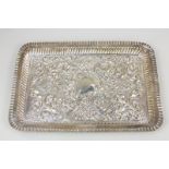 An Edward VII silver trinket tray, makers Robert Pringle & Sons, London 1903, with heavily