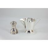 An Elizabeth II silver pepper mill, makers William Comyns & Sons Ltd, London 1977, and an A L