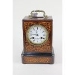A 19th century French inlaid rosewood mantel clock by Marc of Paris, with white enamel dial and