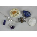 Five various brooches, a golfing bar brooch, and an amethyst dress ring