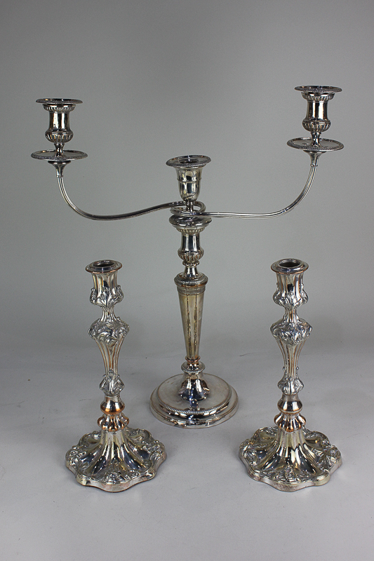 A silver plated three-sconce candelabra, together with a pair of acanthus leaf embossed