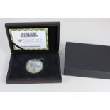 A 9ct gold Numisproof World War One commemorative coin hand painted by Timothy O'Brien, with