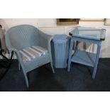 A Lloyd Loom blue armchair, a matching hexagonal linen basket, and a two-tier glass topped table