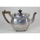 A Victorian silver teapot, maker's mark worn, London 1895, with gadrooned border and scalloped form,